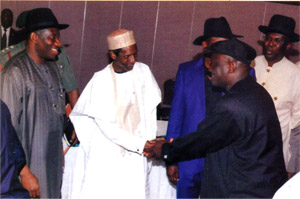 Late Umaru Musa Yar'adua shakes James Jephthah while President Jonathan and Governor Sylva watch in admiration