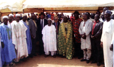 Jepththah poses with member of Katampe 1 & 2 communities in Mpape, FCT Abuja